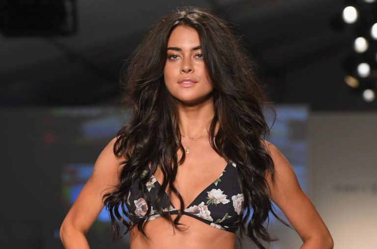 MIAMI, FL - JULY 21: A model walks the runway during the SWIMMIAMI Prey Swim by Audrina Patridge Resort 2018 Collection fashion show at The Tent on July 21, 2017 in Miami, Florida. (Photo by Rodrigo Varela/Getty Images for Prey Swim By Audrina Patridge)