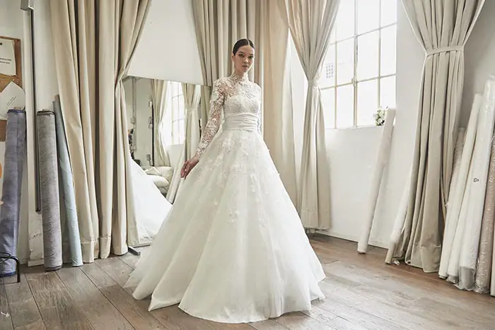 A beautiful laced white dress from the Peter Langner Milano Spring 2023 bridal collection