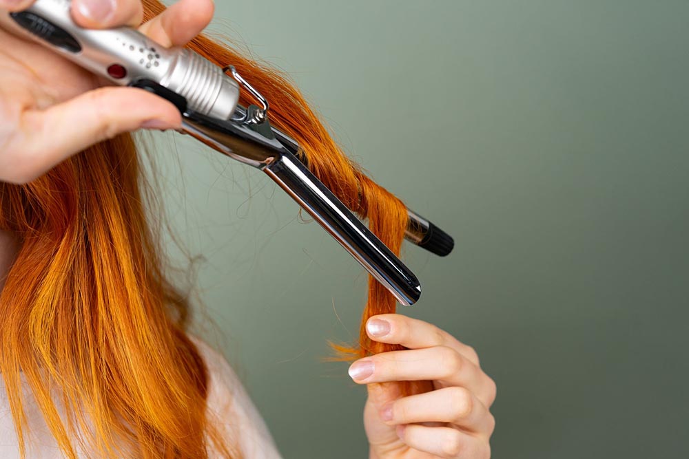 A History of the Curling Iron: From Heated Tongs to the Modern Curling Wand